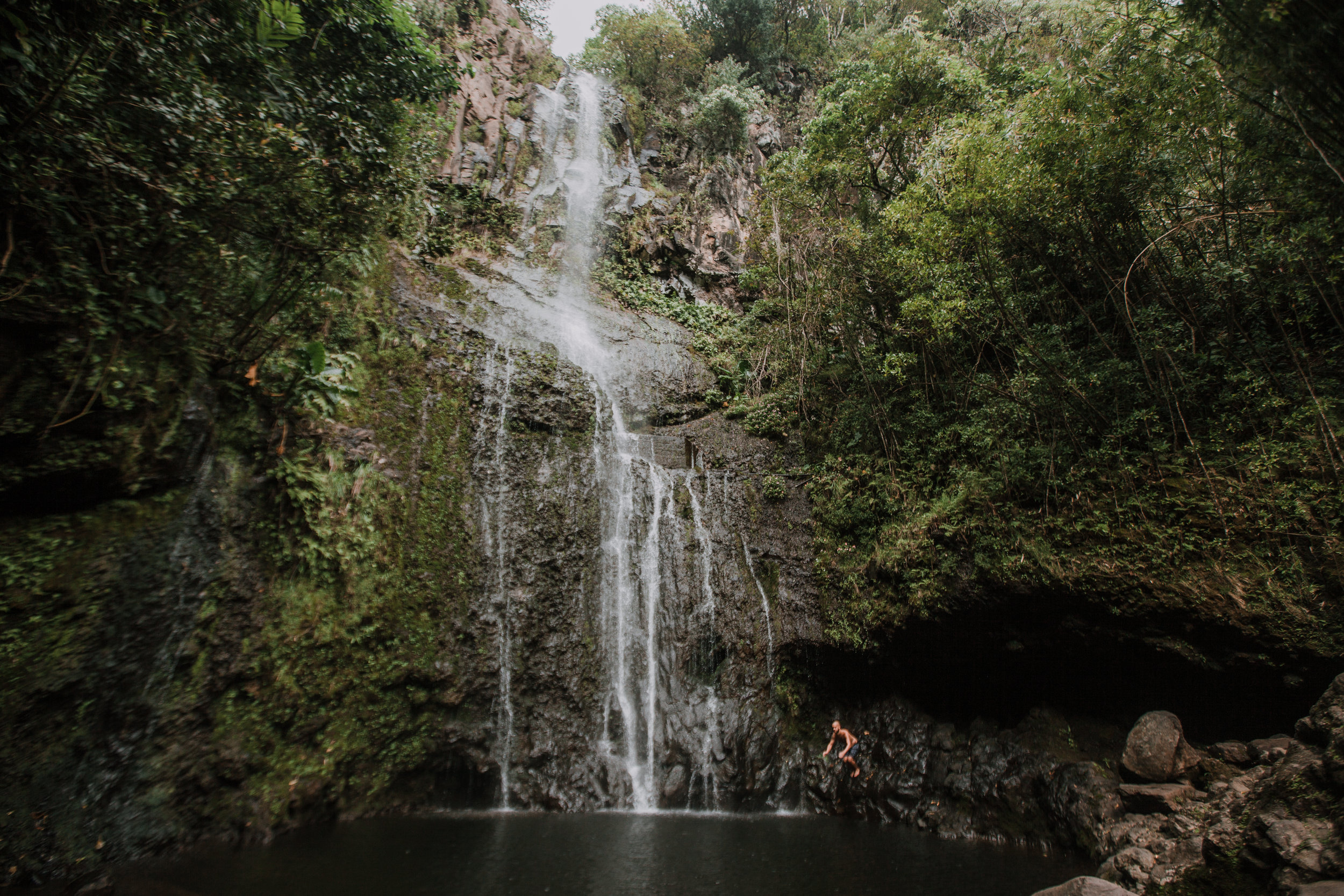 jumping into a hana maui waterfall, hawaii waterfall, road to hana, maui waterfall, hawaii wedding photographer, hawaii elopement photographer, maui wedding, maui engagements, maui elopement