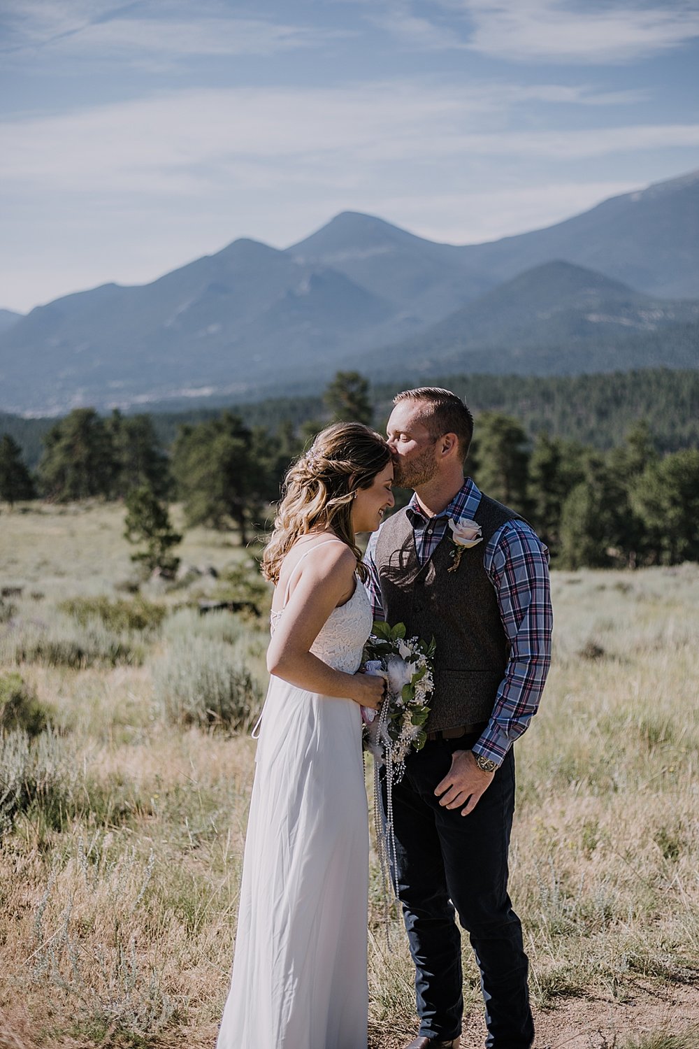 groom kissing bride, rocky mountain national park elopement, 3M curves elopement, self solemnizing, self solemnization, long's peak ceremony, hiking elopement, estes park elopement