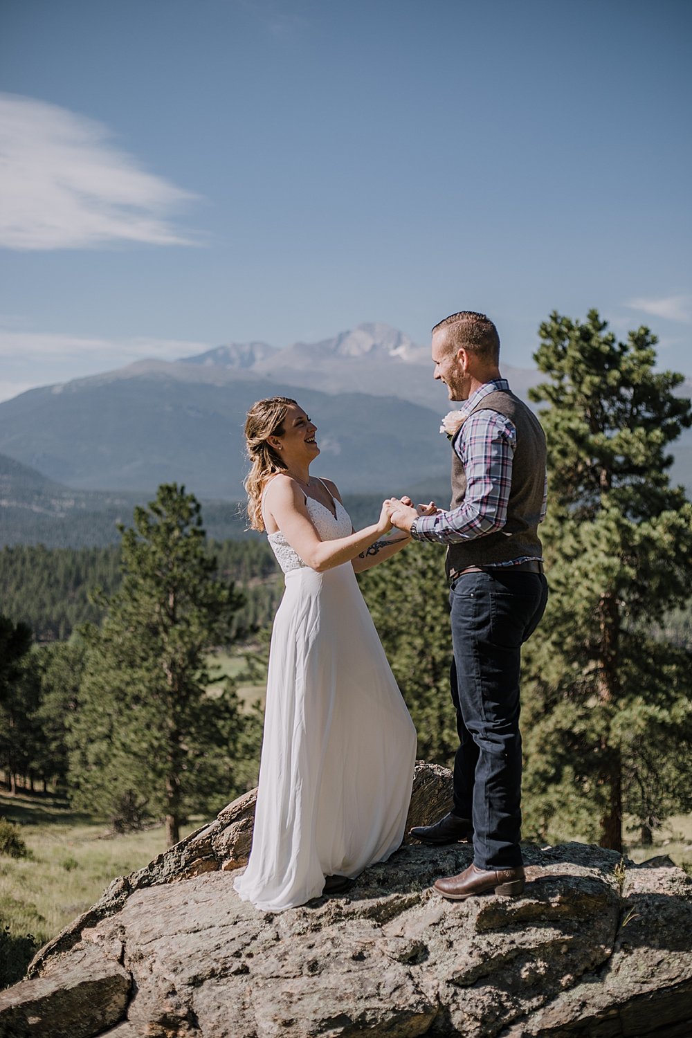 couple in front of long's peak, rocky mountain national park elopement, 3M curves elopement, self solemnizing, self solemnization, long's peak ceremony, hiking elopement, estes park elopement