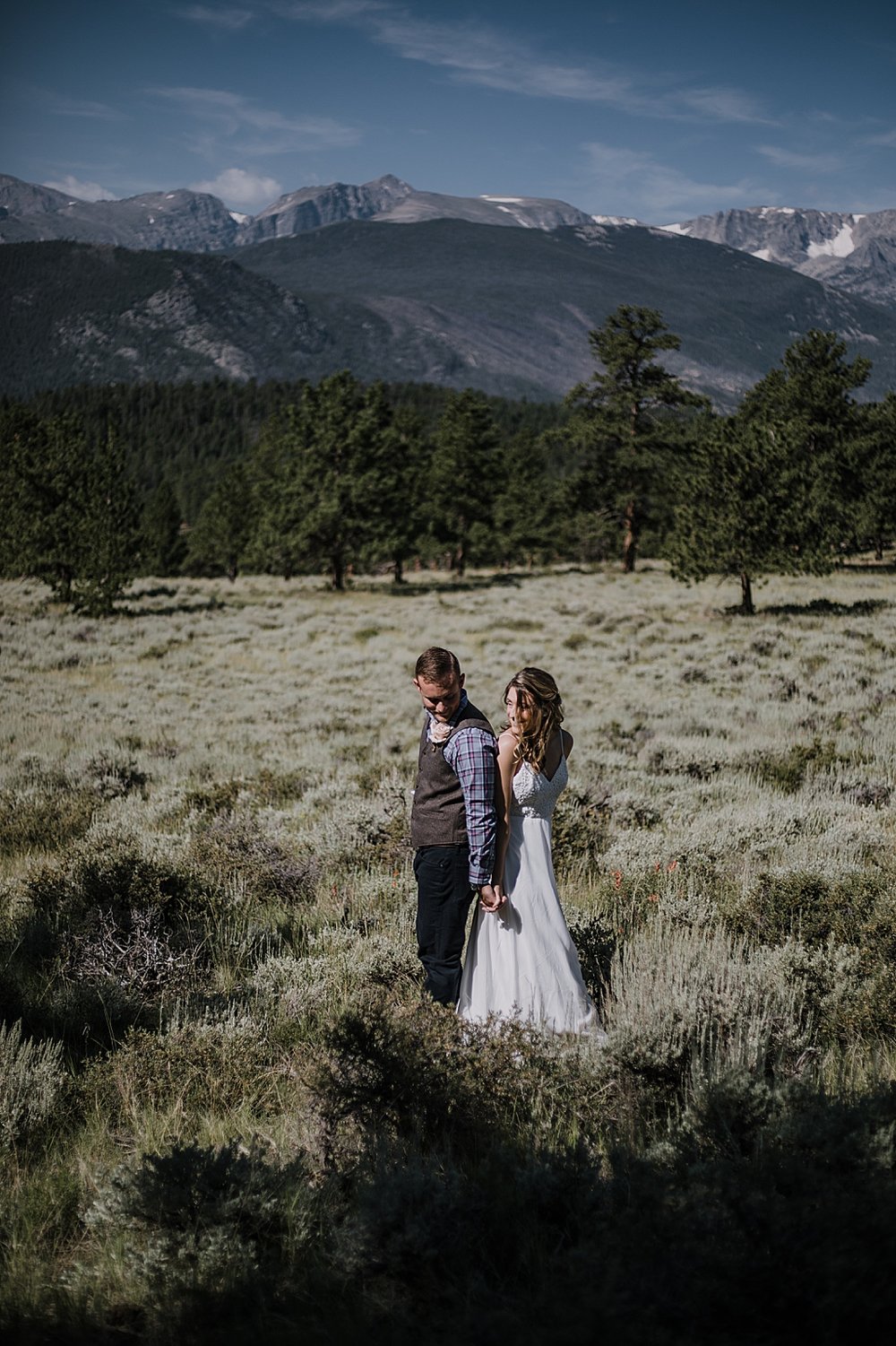 couple in field, RMNP elopement ceremony, rocky mountain national park elopement, 3M curves elopement, self solemnizing, self solemnization, long's peak, summer hiking elopement, estes park elopement