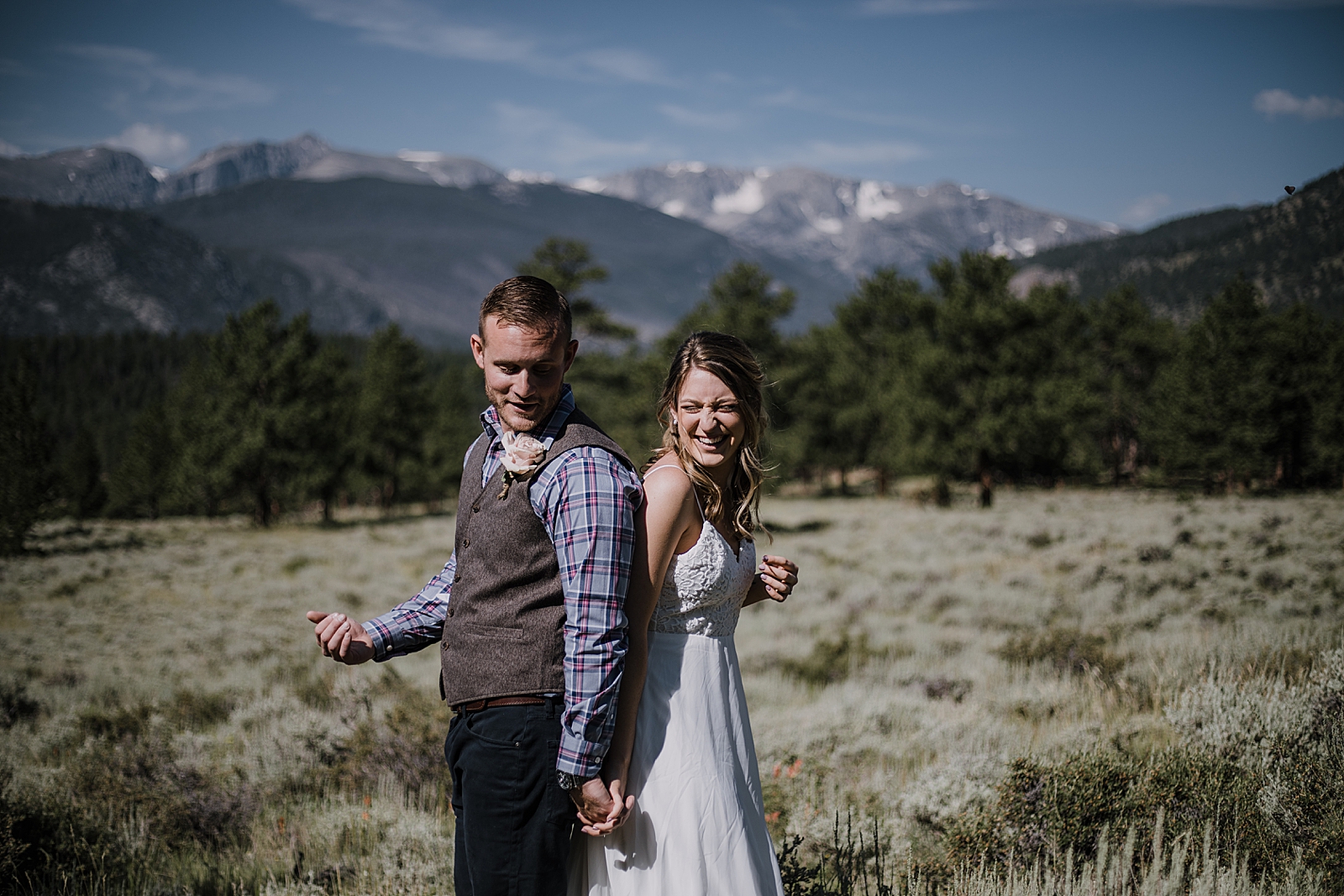couple in field, RMNP elopement ceremony, rocky mountain national park elopement, 3M curves elopement, self solemnizing, self solemnization, long's peak, summer hiking elopement, estes park elopement