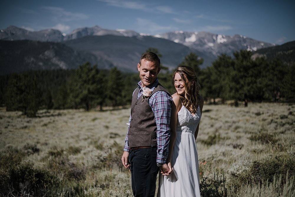 couple laughing, RMNP elopement ceremony, rocky mountain national park elopement, 3M curves elopement, self solemnizing, self solemnization, long's peak, summer hiking elopement, estes park elopement