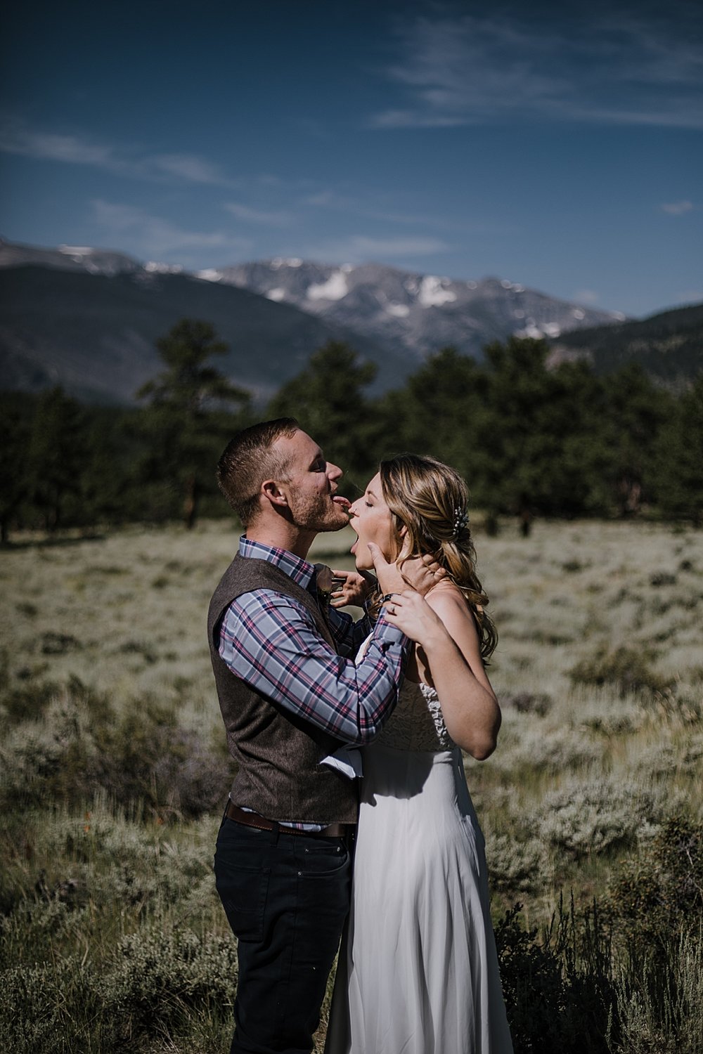 groom licks bride, RMNP elopement ceremony, rocky mountain national park elopement, 3M curves elopement, self solemnizing, self solemnization, long's peak, summer elopement, estes park elopement