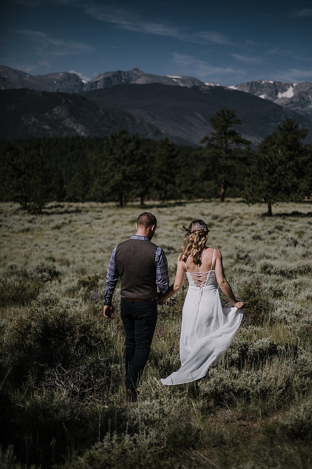 groom and bride hiking, RMNP elopement ceremony, rocky mountain national park elopement, 3M curves elopement, self solemnizing, self solemnization, long's peak, summer elopement, estes park elopement