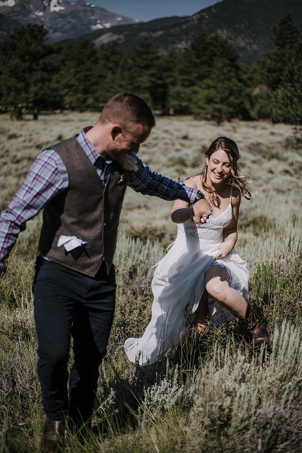 groom and bride running, RMNP elopement ceremony, rocky mountain national park elopement, 3M curves elopement, self solemnizing, self solemnization, long's peak, summer elopement, estes park elopement