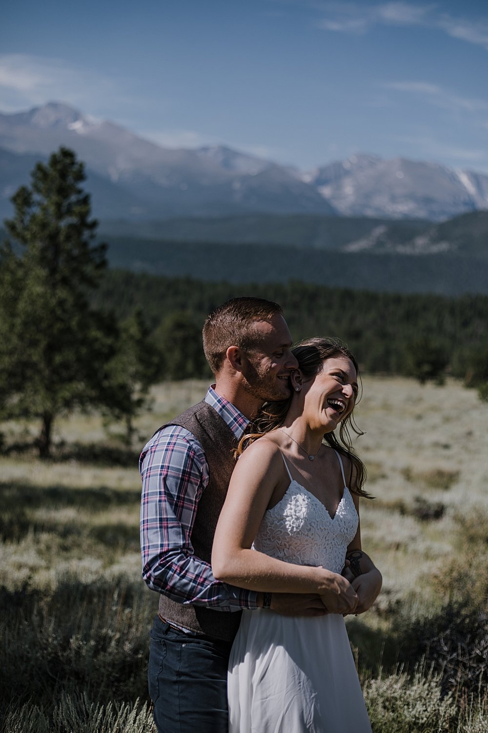 groom kissing bride, RMNP elopement ceremony, rocky mountain national park elopement, 3M curves elopement, self solemnizing, self solemnization, long's peak, summer elopement, estes park elopement