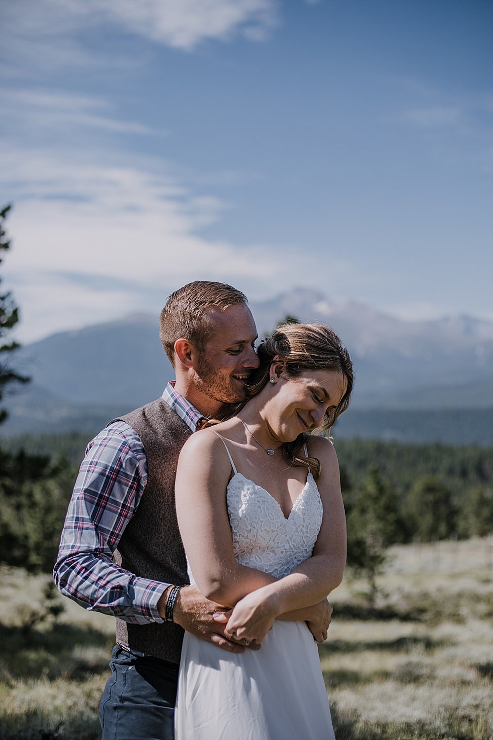 groom kissing bride, RMNP elopement ceremony, rocky mountain national park elopement, 3M curves elopement, self solemnizing, self solemnization, long's peak, summer elopement, estes park elopement