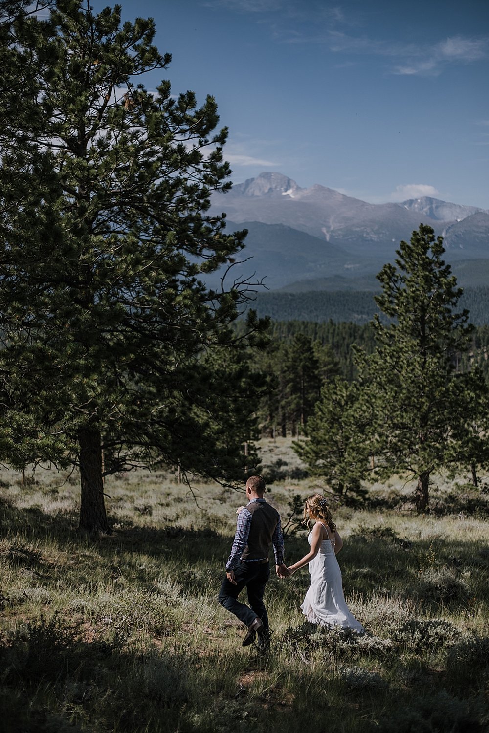 bride and groom hiking, RMNP elopement ceremony, rocky mountain national park elopement, 3M curves elopement, self solemnizing, self solemnization, long's peak, summer elopement, estes park elopement