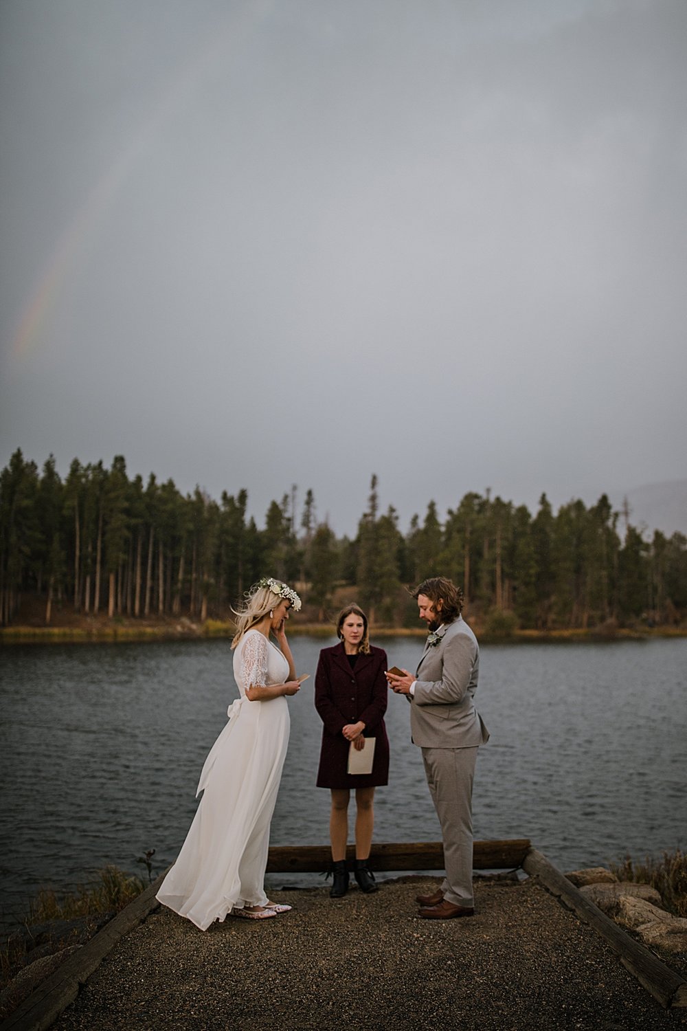 bride and groom in the rain, sprague lake dock elopement, sunrise elopement, colorado elopement, sprague lake elopement, rocky mountain national park elopement, adventurous colorado hiking elopement