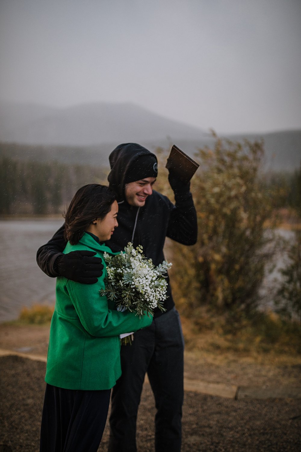 guests in the rain, sprague lake dock elopement, sunrise elopement, colorado elopement, sprague lake elopement, rocky mountain national park elopement, adventurous colorado hiking elopement