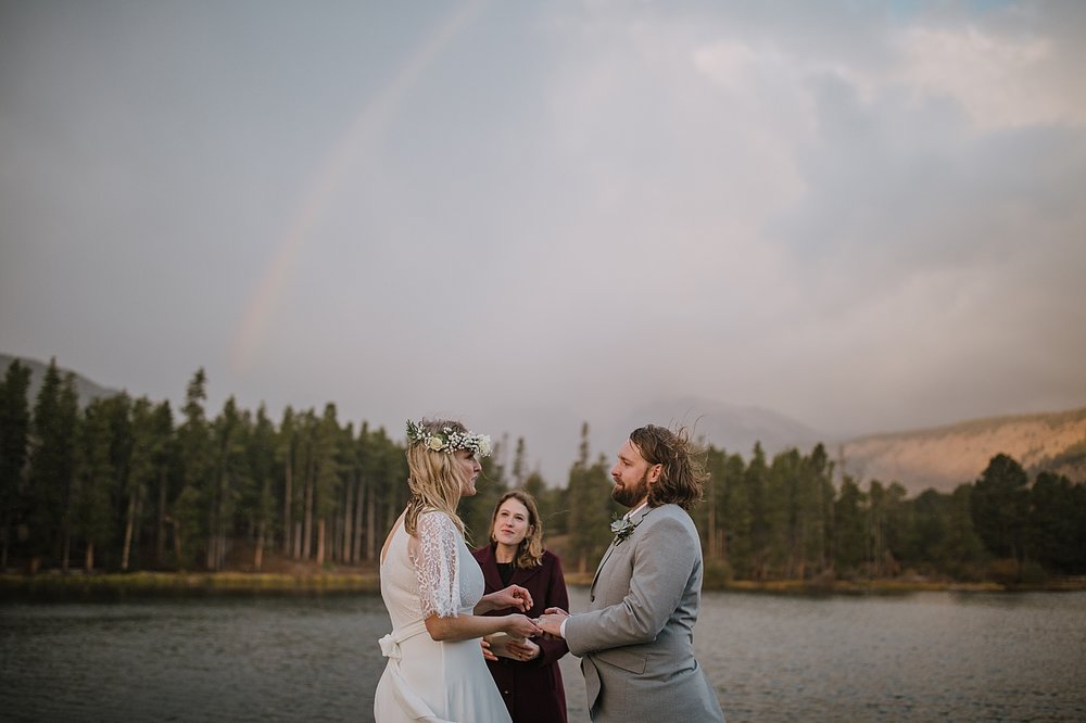 bride and groom wedding rings, sprague lake dock elopement, sunrise elopement, colorado elopement, sprague lake elopement, rocky mountain national park elopement, adventurous colorado hiking elopement