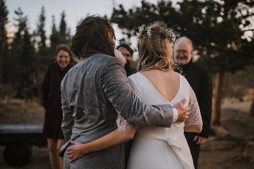 bride and groom soaked, sprague lake dock elopement, sunrise elopement, colorado elopement, sprague lake elopement, rocky mountain national park elopement, adventurous colorado hiking elopement