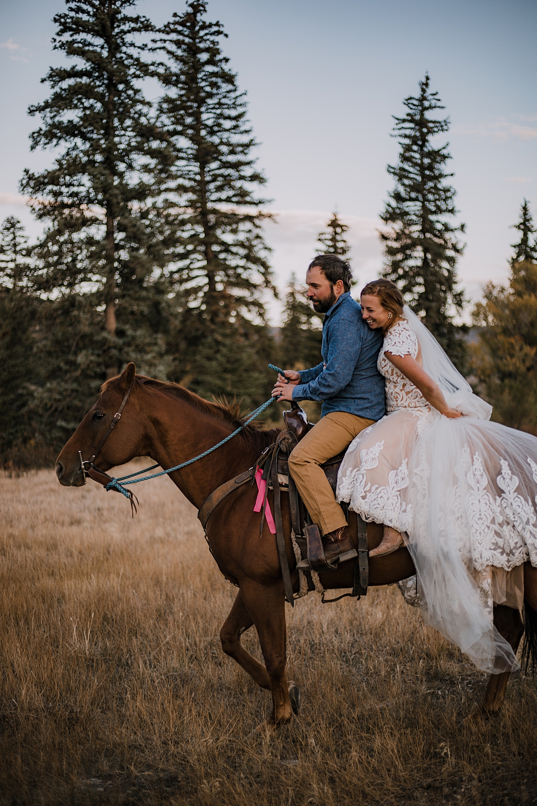 bride and groom riding horses, sunrise horseback riding in colorado, silverthorne colorado elopement, silverthorne colorado wedding, horseback riding on your wedding day, day after session