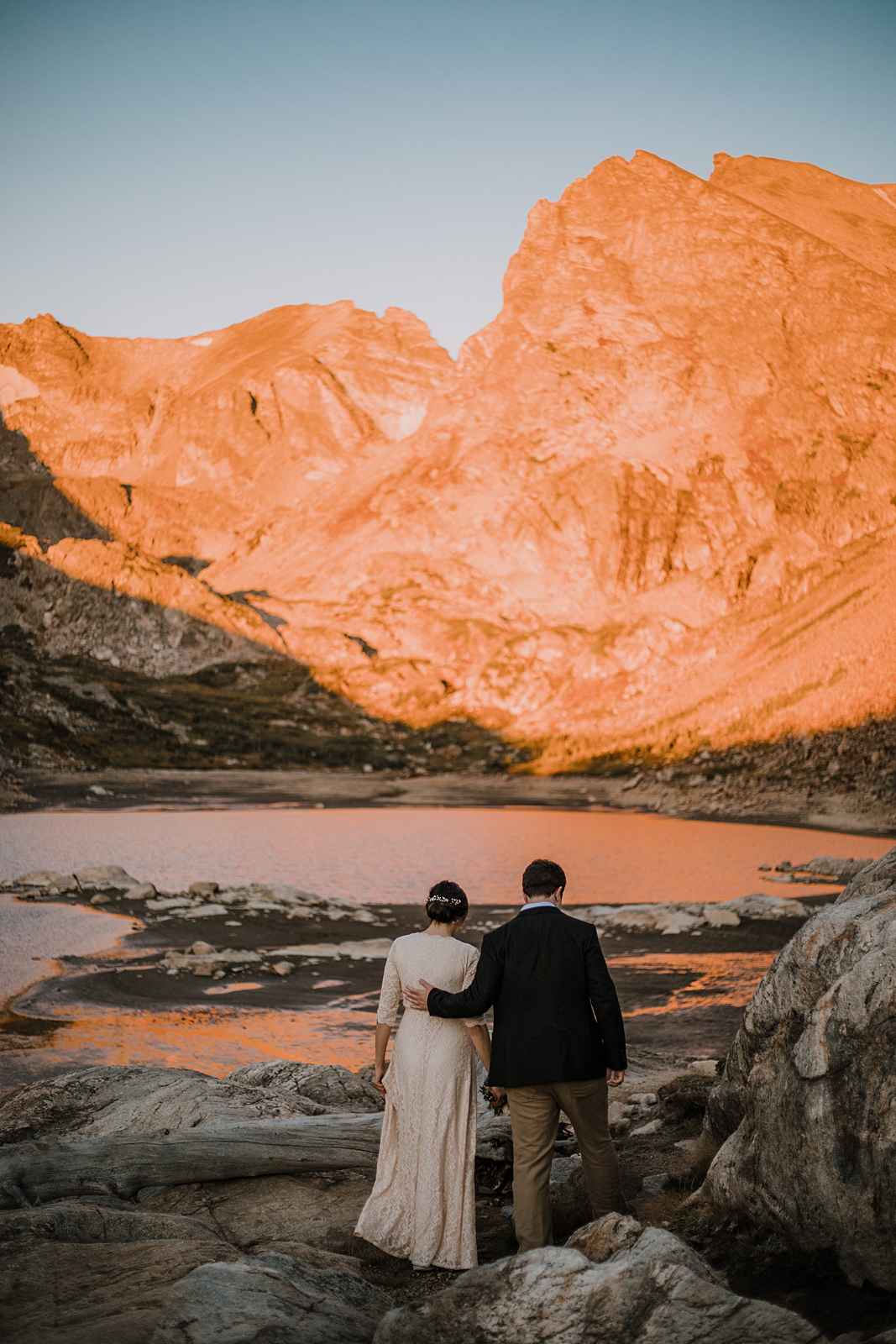 couple hiking in the indian peaks wilderness area, sunrise elopement at lake isabelle colorado, indian peaks hiking elopement, alpine glow on the indian peaks colorado