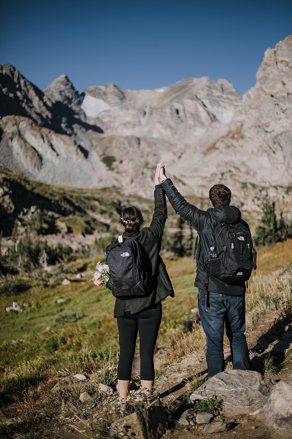 couple hiking in the indian peaks wilderness area, sunrise elopement at lake isabelle colorado, indian peaks hiking elopement, alpine glow on the indian peaks colorado