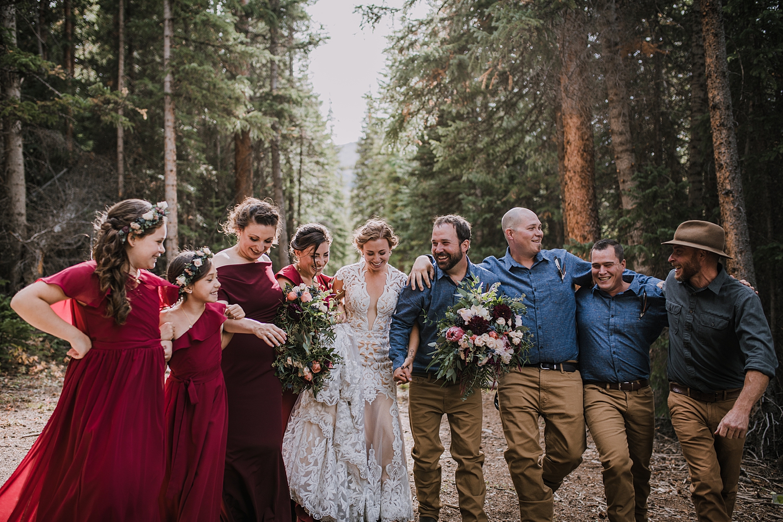 groom holding veil, hiking the cucumber gulch trail in breckenridge colorado, breckenridge nordic center summer wedding, summer wedding in breckenridge colorado, hiking the breckenridge nordic trails