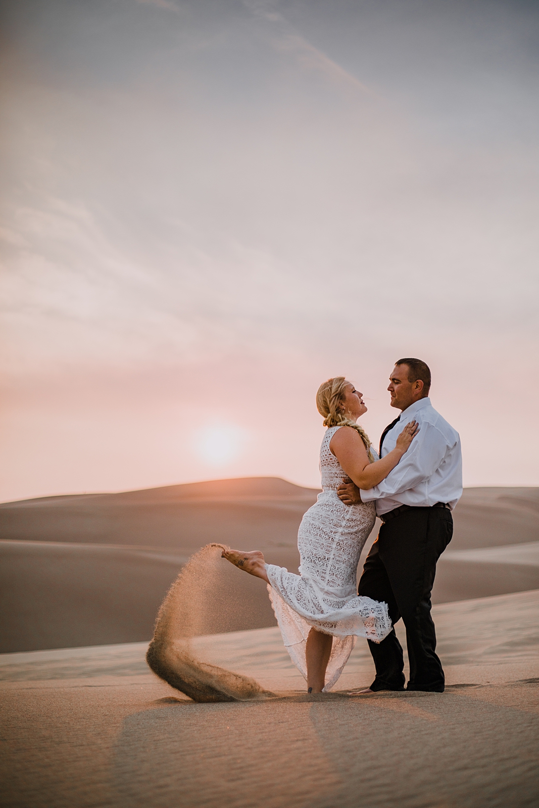 couple hiking the great sand dunes near crestone colorado, great sand dunes national park hiking, great sand dunes national park sunset elopement, elope at the great sand dunes