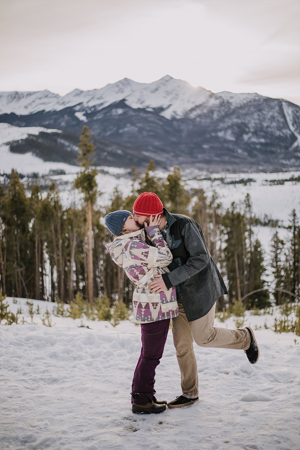 couple playing in the snow, officers gulch colorado elopement, hiking officers gulch near frisco and copper colorado, snowy colorado engagements