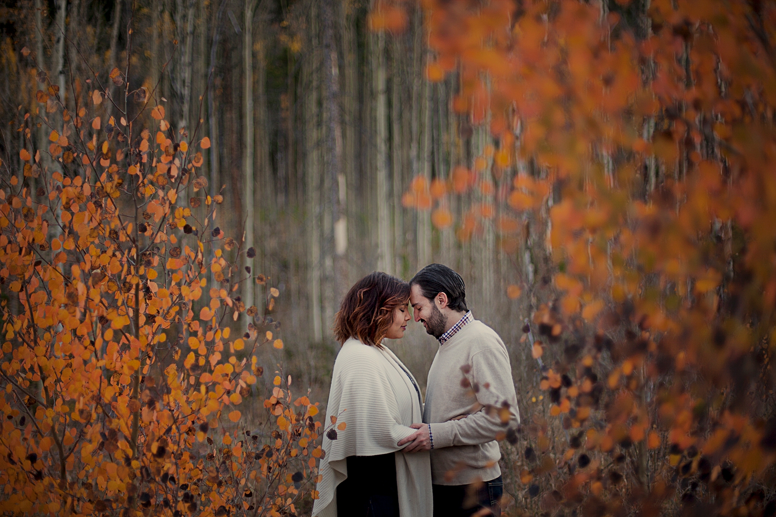couple hiking through fall aspen leaves, hiking miners creek trail, hiking trails in frisco colorado, fall colors summit county colorado, frisco colorado engagement photographer