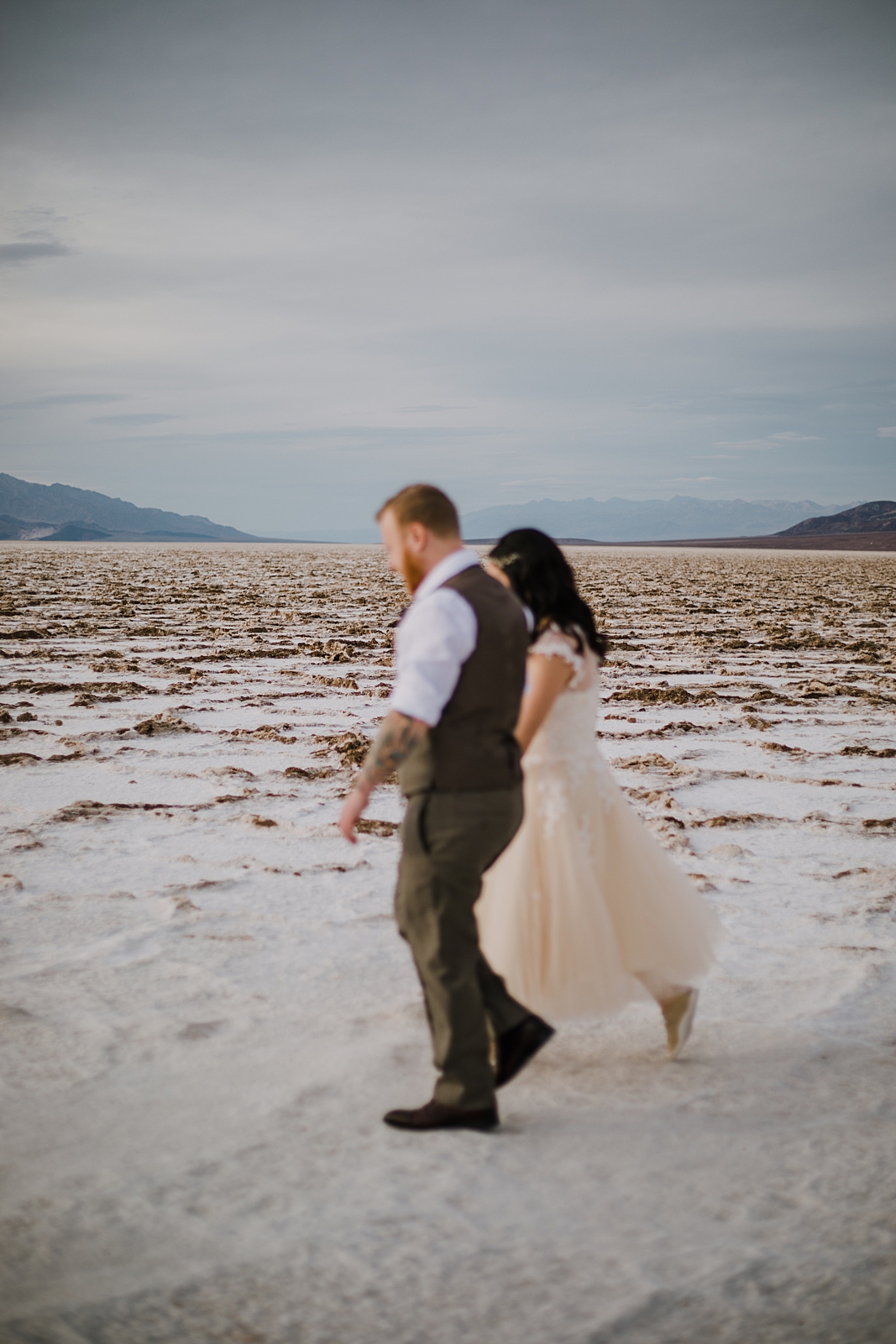 walking on the salt flats, death valley national park elopement, elope in death valley, badwater basin elopement, hiking in death valley national park, sunset at badwater basin