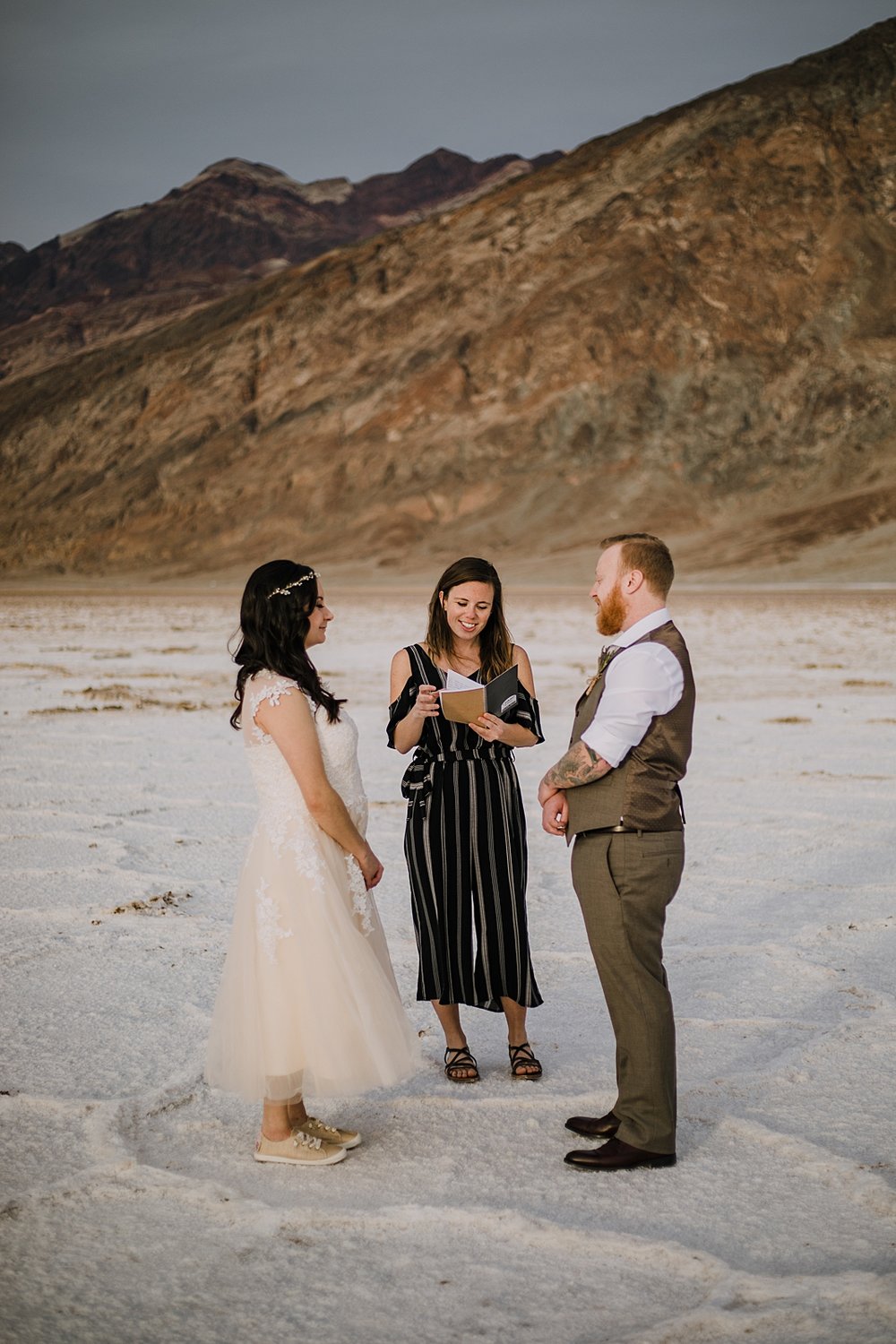 couple eloping on salt flats, death valley national park elopement, elope in death valley, badwater basin elopement, hiking in death valley national park, sunset at badwater basin