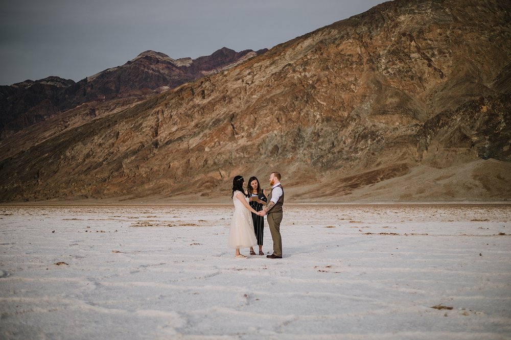 eloping on the salt flats, death valley national park elopement, elope in death valley, badwater basin elopement, hiking in death valley national park, sunset at badwater basin