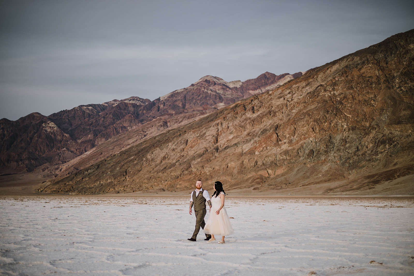 hiking across the salt flats, death valley national park elopement, elope in death valley, badwater basin elopement, hiking in death valley national park, sunset at badwater basin