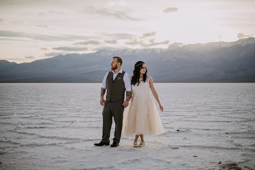 hiking across the salt flats, death valley national park elopement, elope in death valley, badwater basin elopement, hiking in death valley national park, sunset at badwater basin