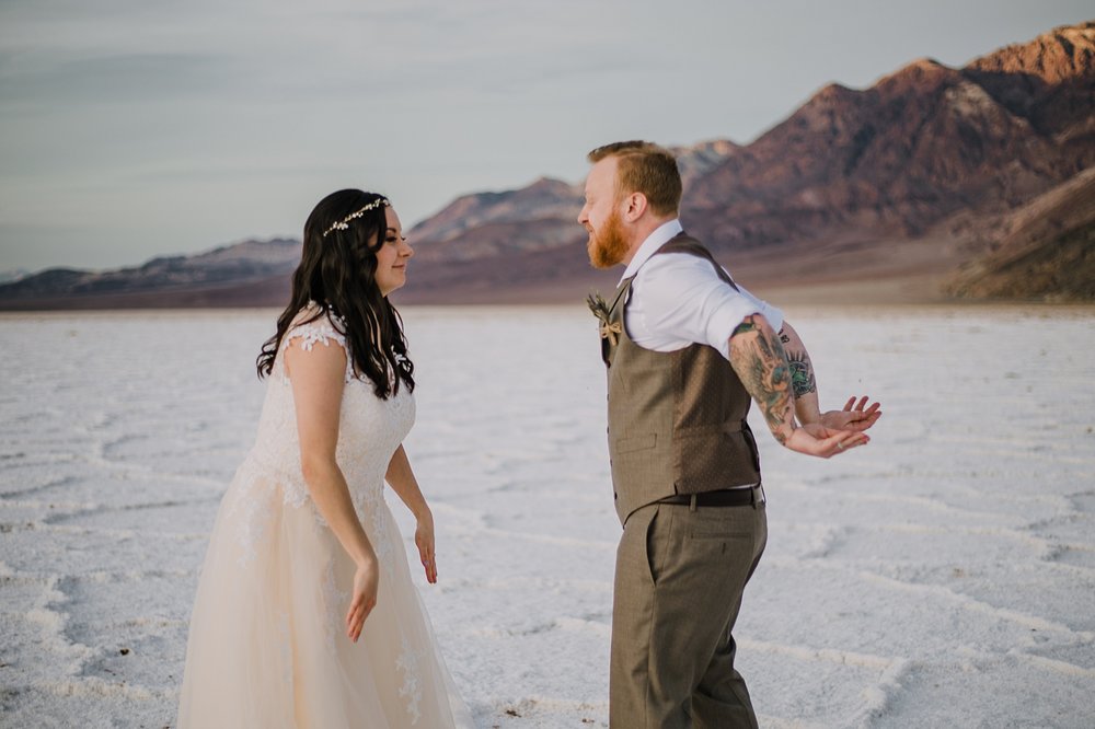 playing on the salt flats, death valley national park elopement, elope in death valley, badwater basin elopement, hiking in death valley national park, sunset at badwater basin