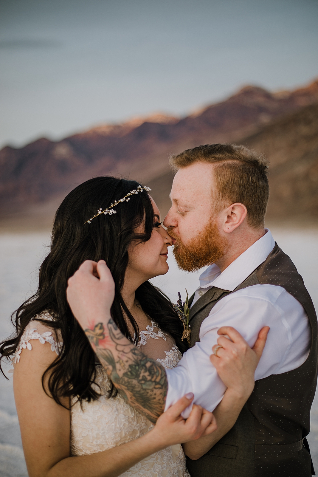 couple kissing on the salt flats, death valley national park elopement, elope in death valley, badwater basin elopement, hiking in death valley national park, sunset at badwater basin