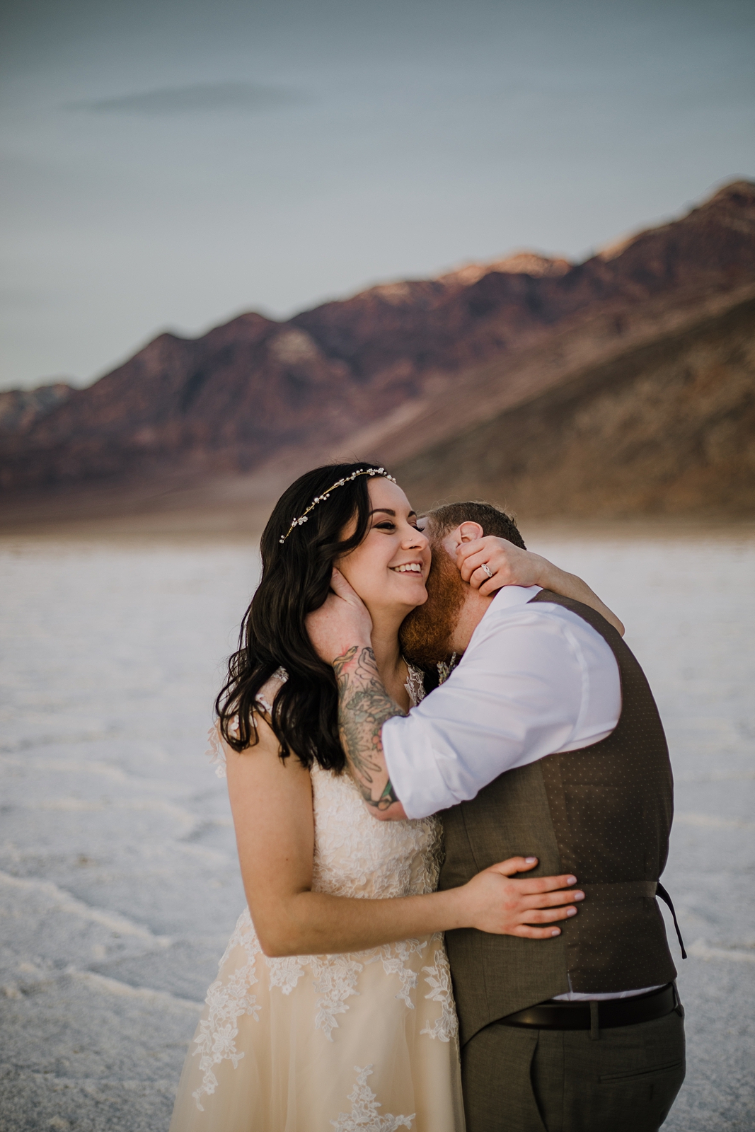 couple kissing on the salt flats, death valley national park elopement, elope in death valley, badwater basin elopement, hiking in death valley national park, sunset at badwater basin