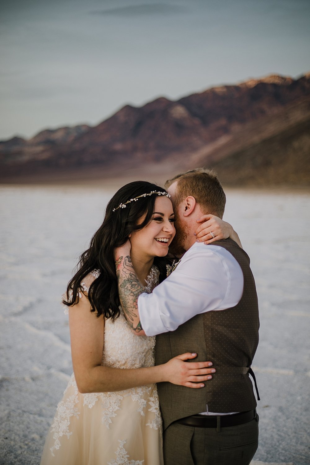 couple kissing on the salt flats, death valley national park elopement, elope in death valley, badwater basin elopement, hiking in death valley national park, sunset at badwater basin