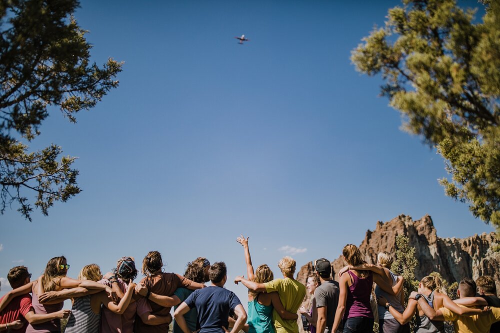 plane overhead, bridal party on cliff edge of crooked river, mt hood national forest, smith rock state park wedding, smith rock state park hiking elopement, terrebonne oregon backyard wedding