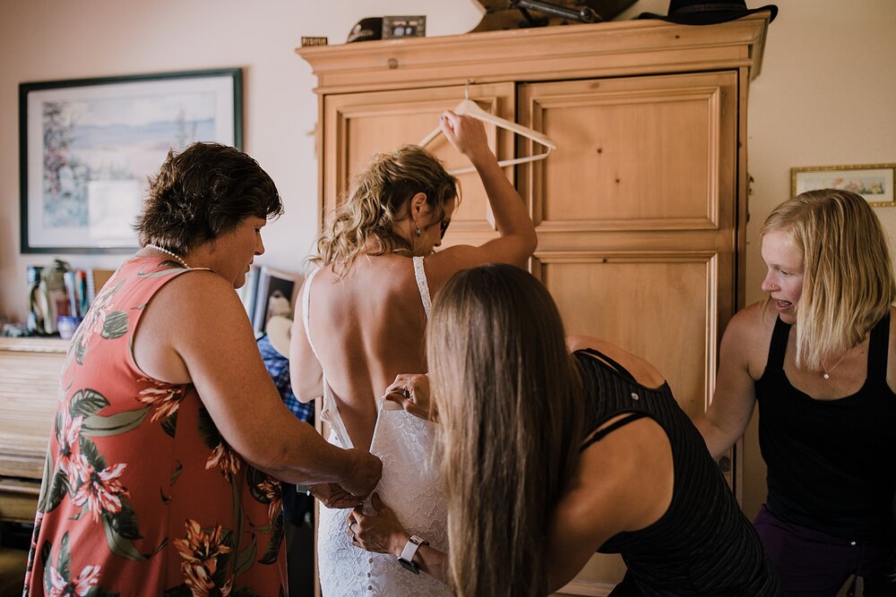 bride putting on dress, mt hood elopement, mt hood wedding, mt hood national forest, smith rock state park wedding, smith rock state park hiking elopement, terrebonne oregon backyard wedding