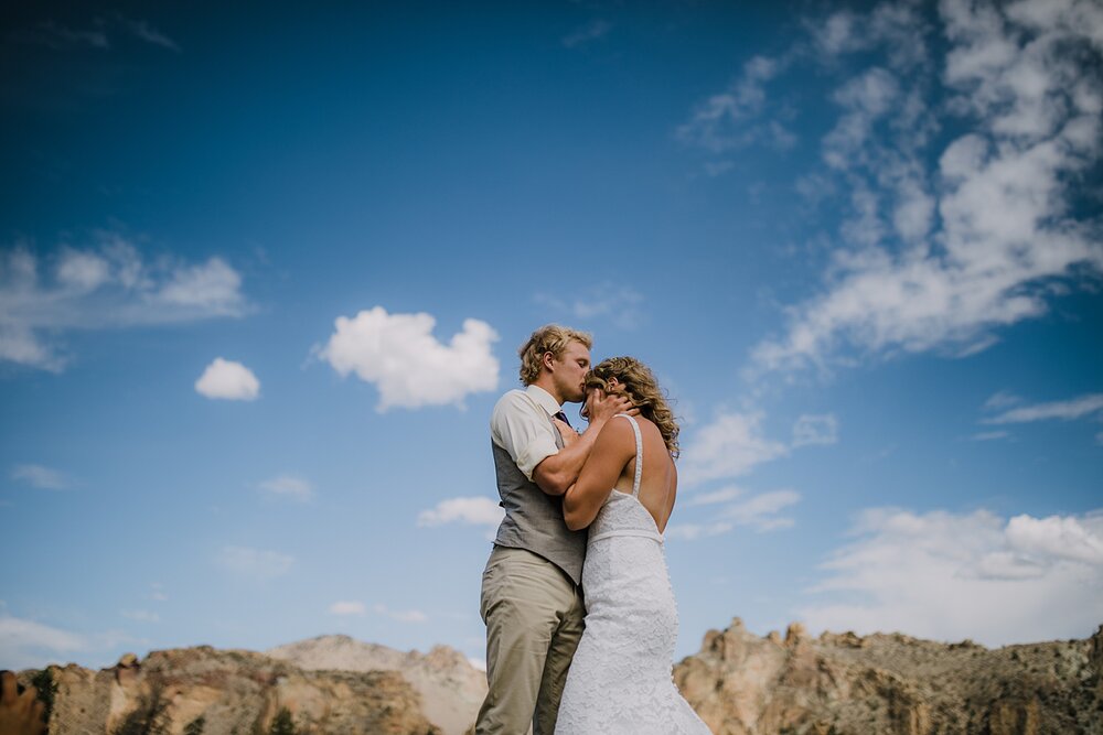 bride and groom kissing at smith rock state park, mt hood elopement, mt hood national forest, smith rock state park wedding, smith rock state park hiking elopement, terrebonne oregon backyard wedding