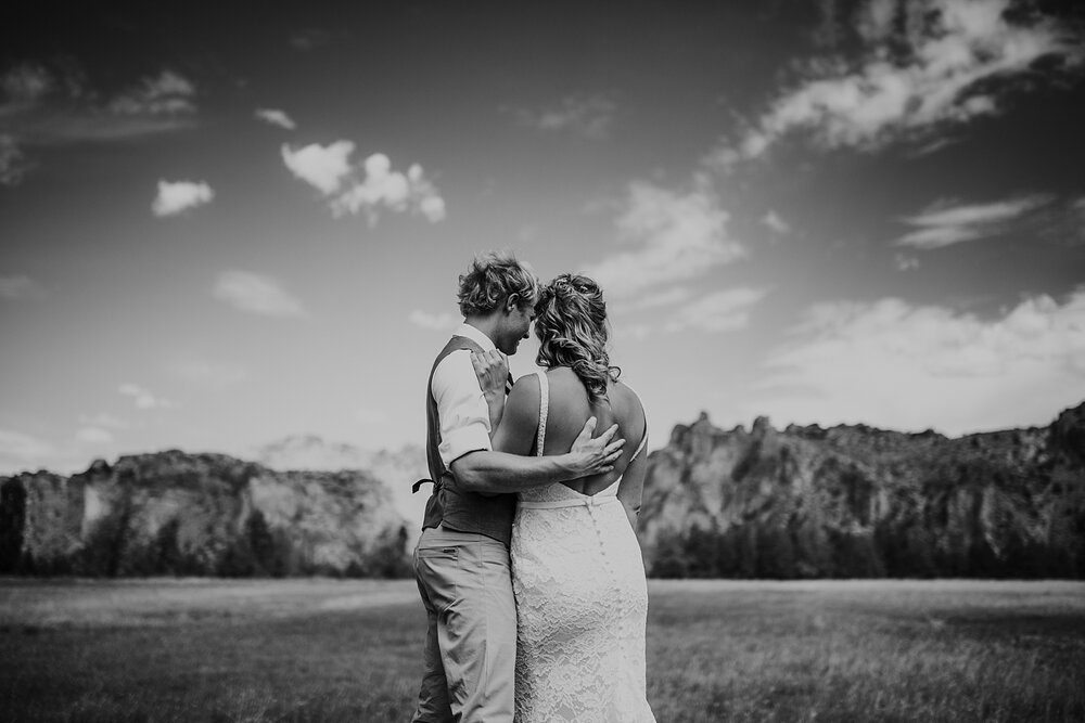 bride and groom hugging at smith rock state park, mt hood elopement, mt hood national forest, smith rock state park wedding, smith rock state park hiking elopement, terrebonne oregon backyard wedding