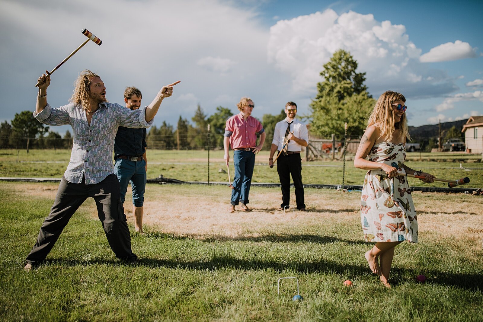guests playing yard games at backyard wedding, mt hood elopement, mt hood national forest, smith rock state park wedding, smith rock state park hiking elopement, terrebonne oregon backyard wedding