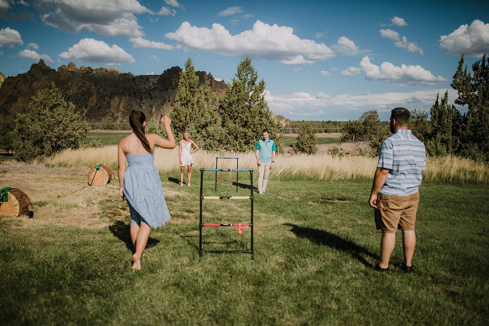 guests playing yard games at backyard wedding, mt hood elopement, mt hood national forest, smith rock state park wedding, smith rock state park hiking elopement, terrebonne oregon backyard wedding