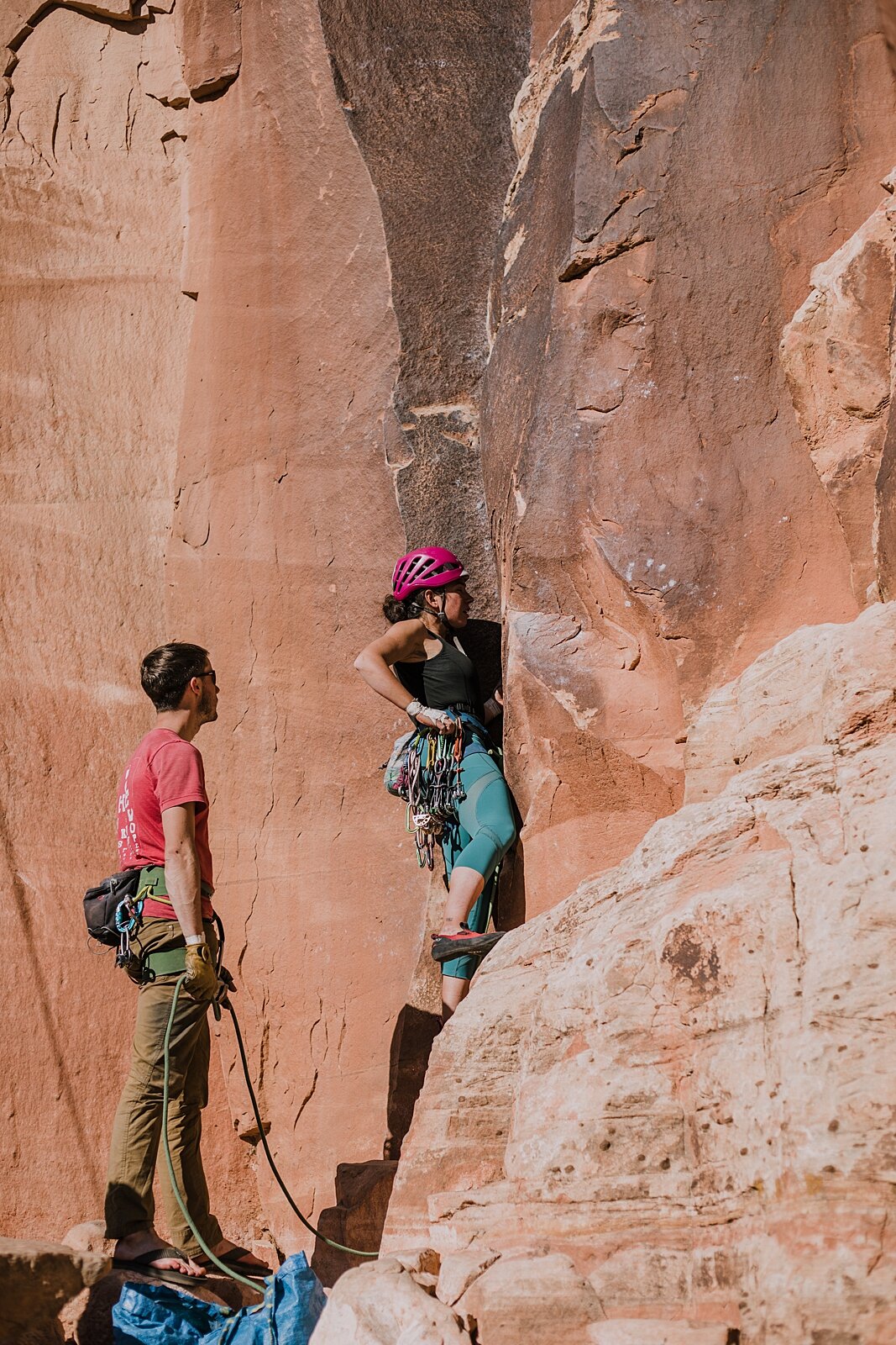 couple climbing together in indian creek near monticello utah, indian creek climbing area, canyonlands national park, moab utah climbing engagements, crack climbing moab utah