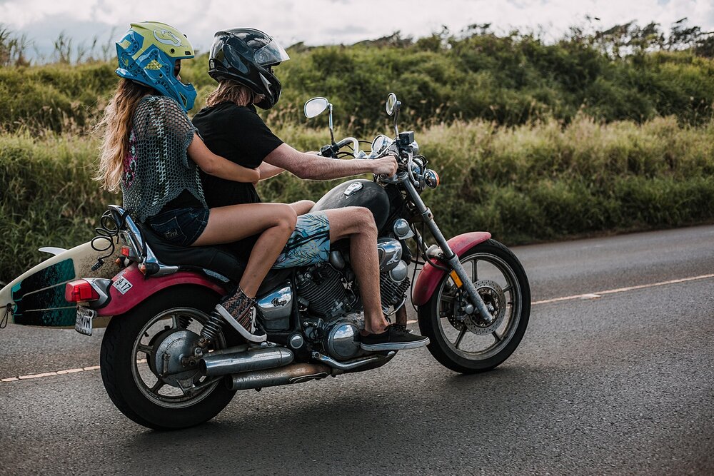 motorcycle driving on the road to hana, couple riding a motorcycle, maui hawaii photographer, maui hawaii surfing, surfing at ho'okipa beach, ho'okipa beach engagements, motorcycle engagements