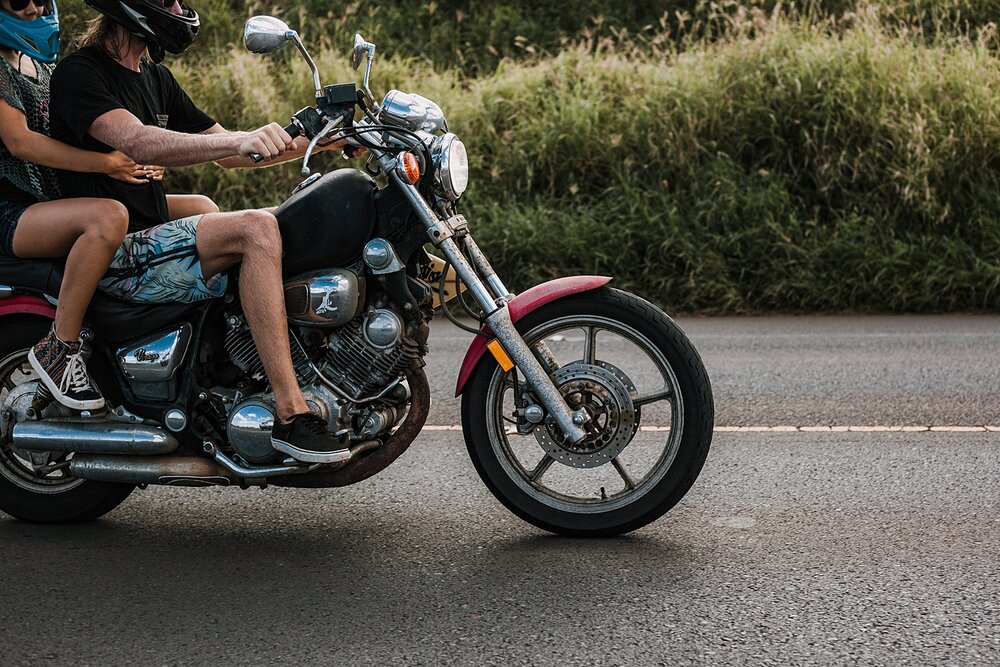 motorcycle with a surfboard, motorcycle driving on the road to hana, couple riding a motorcycle, maui hawaii photographer, maui hawaii surfing, surfing at ho'okipa beach, ho'okipa beach engagements