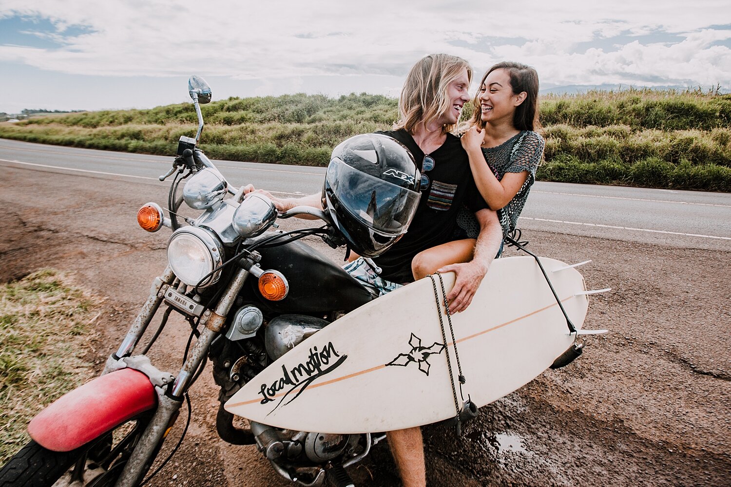 couple on motorcycle, couple riding a motorcycle, maui hawaii photographer, maui hawaii surfing, surfing at ho'okipa beach, ho'okipa beach engagements, motorcycle engagements