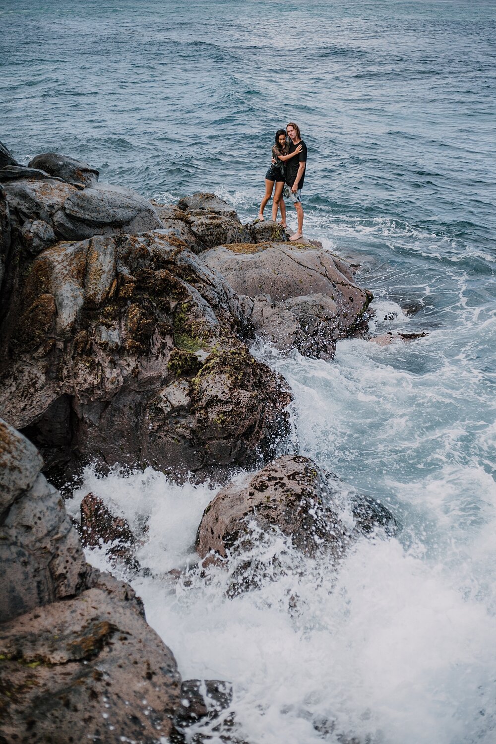 hiking on volcanic lava rocks on ho'okipa beach, couple hiking ho'okipa, maui hawaii photographer, maui hawaii surfing, surfing at ho'okipa beach, ho'okipa beach engagements, motorcycle engagements