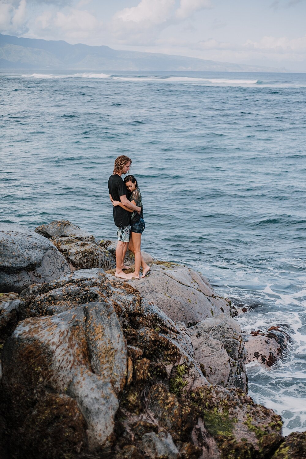 hiking on volcanic lava rocks on ho'okipa beach, couple hiking ho'okipa, maui hawaii photographer, maui hawaii surfing, surfing at ho'okipa beach, ho'okipa beach engagements, motorcycle engagements