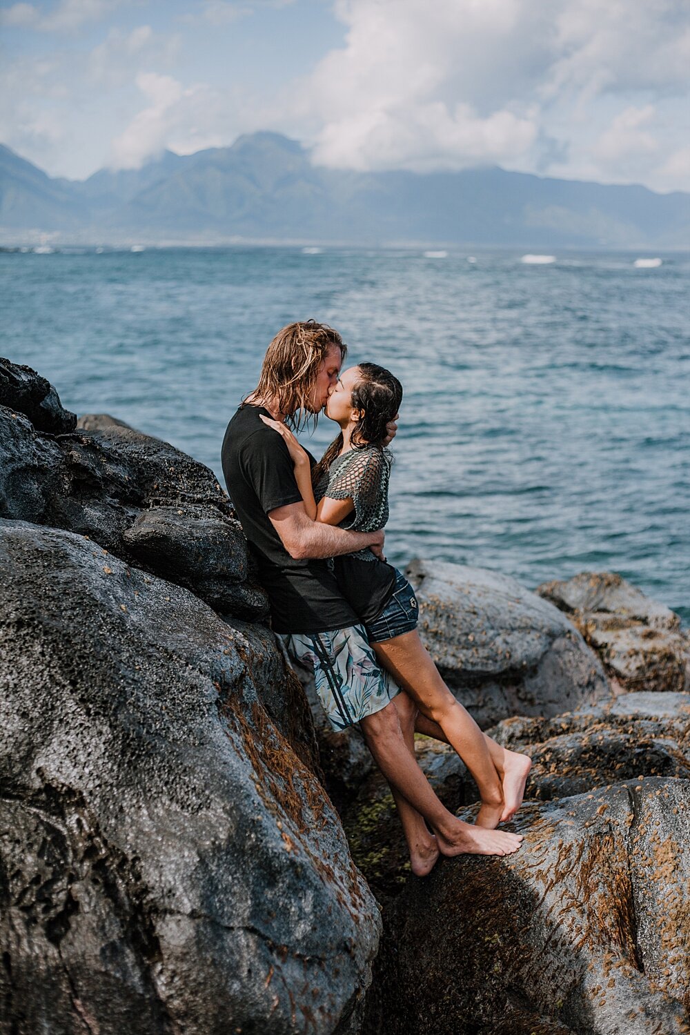 hiking on volcanic lava rocks on ho'okipa beach, couple hiking ho'okipa, maui hawaii photographer, maui hawaii surfing, surfing at ho'okipa beach, ho'okipa beach engagements, motorcycle engagements