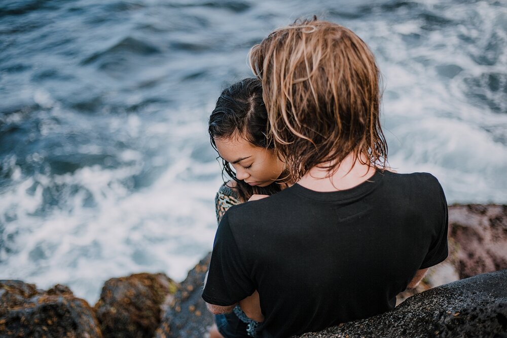 hiking on volcanic lava rocks on ho'okipa beach, couple hiking ho'okipa, maui hawaii photographer, maui hawaii surfing, surfing at ho'okipa beach, ho'okipa beach engagements, motorcycle engagements