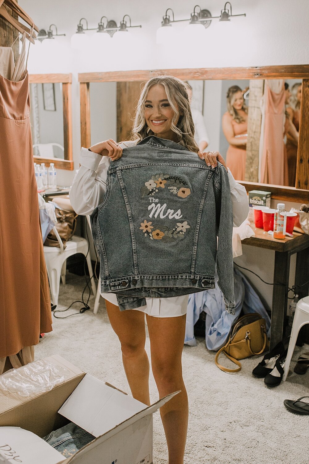 bridesmaids embroidered jean jackets, the barn at sunset ranch in buena vista co, buena vista colorado wedding, the barn at sunset ranch wedding, buena vista colorado wedding venue