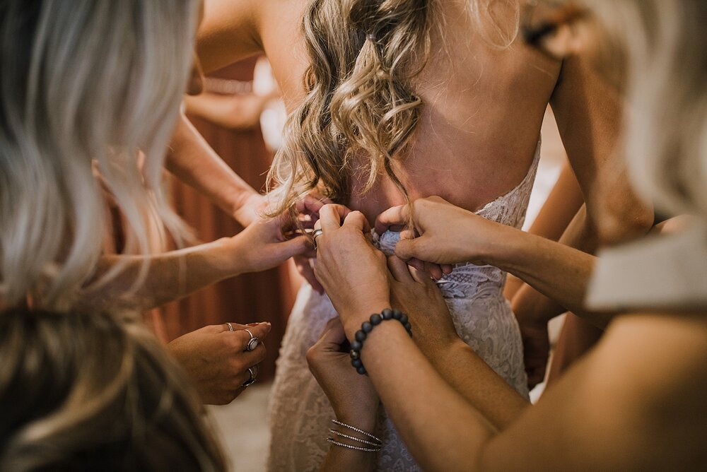 bride putting on dress, the barn at sunset ranch in buena vista co, buena vista colorado wedding, the barn at sunset ranch wedding, buena vista colorado wedding venue