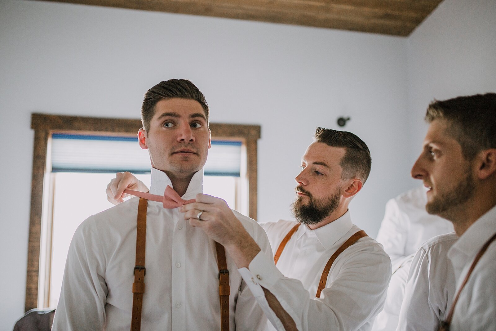 groom getting ready, groom bowtie, groom suspenders,the barn at sunset ranch in buena vista co, buena vista colorado wedding, the barn at sunset ranch wedding, buena vista colorado wedding venue