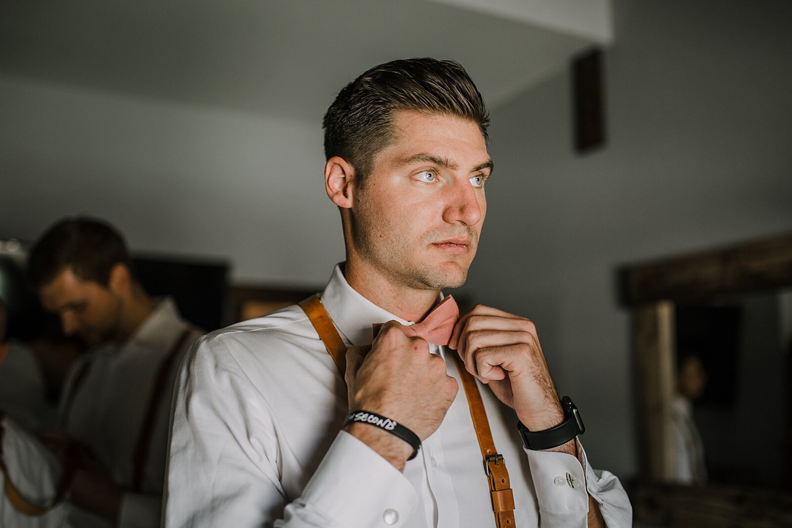 groom getting ready, groom bowtie, groom suspenders, the barn at sunset ranch in buena vista co, buena vista colorado wedding, the barn at sunset ranch wedding, buena vista colorado wedding venue